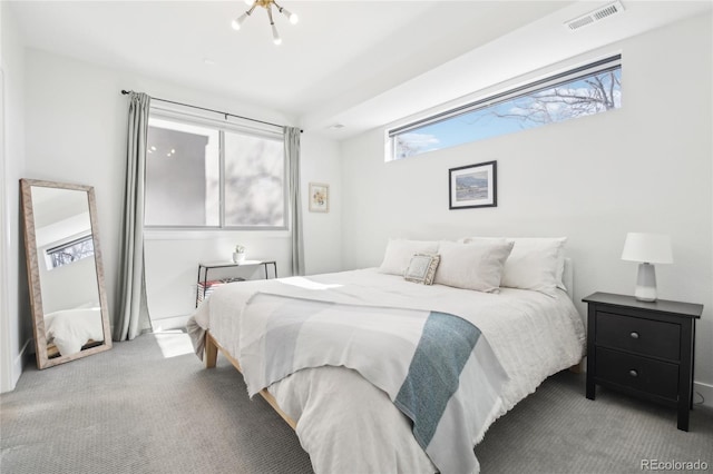 bedroom with carpet floors and visible vents