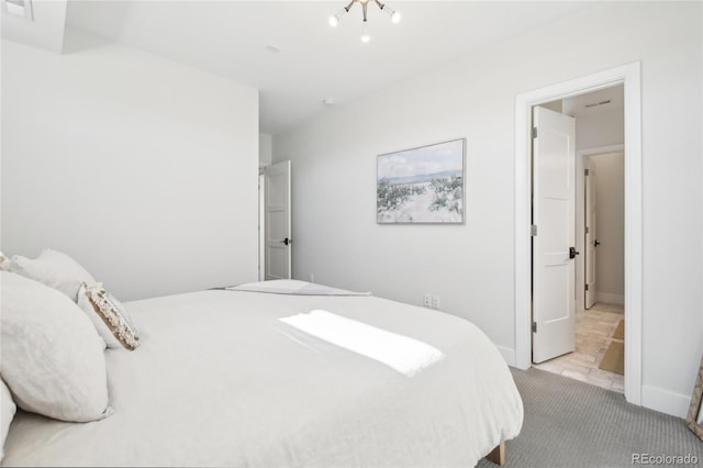 bedroom with carpet flooring and baseboards