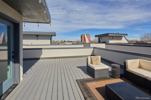 deck with a view of city and an outdoor living space