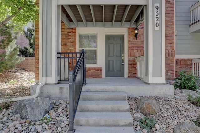 9520 Halstead, Lone Tree, CO 80124 - view of exterior entry with brick siding and covered porch