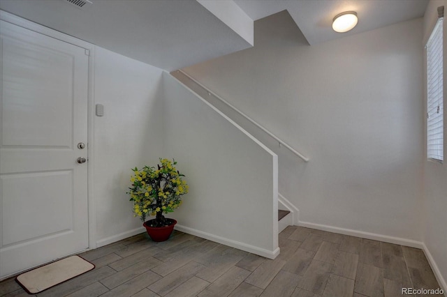 9520 Halstead, Lone Tree, CO 80124 - foyer featuring wood finished floors, stairs, and baseboards