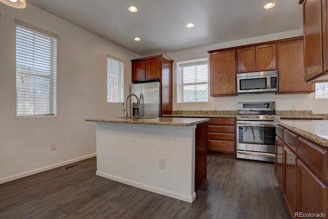 9520 Halstead, Lone Tree, CO 80124 - kitchen with stainless steel appliances, dark wood finished floors, light stone counters, baseboards, and recessed lighting