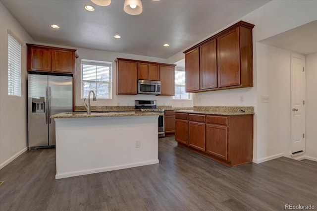 9520 Halstead, Lone Tree, CO 80124 - kitchen featuring appliances with stainless steel finishes, dark wood-style floors, a sink, healthy amount of natural light, and recessed lighting