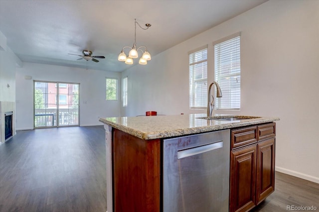 9520 Halstead, Lone Tree, CO 80124 - kitchen with stainless steel dishwasher, a sink, dark wood-style floors, open floor plan, and baseboards