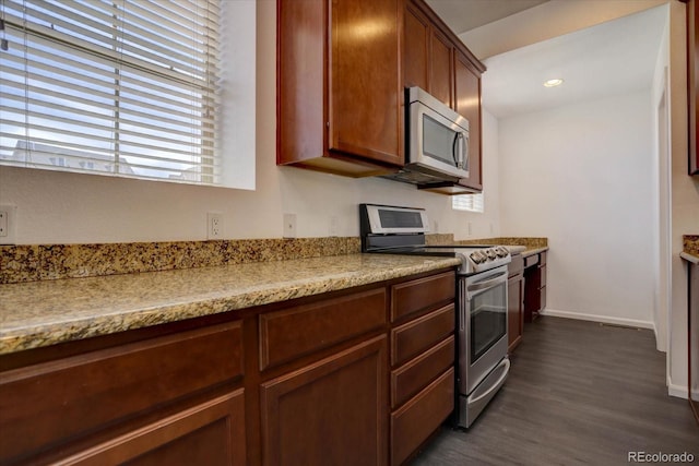 9520 Halstead, Lone Tree, CO 80124 - kitchen with stainless steel appliances, dark wood-style flooring, and baseboards