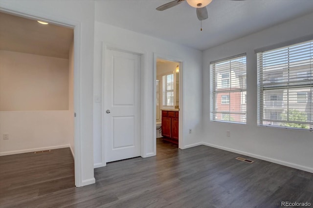 9520 Halstead, Lone Tree, CO 80124 - unfurnished bedroom featuring baseboards, dark wood-type flooring, ensuite bath, and ceiling fan