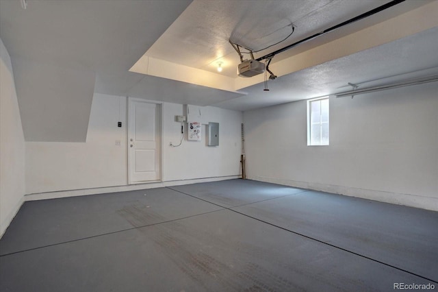 9520 Halstead, Lone Tree, CO 80124 - garage with electric panel, a garage door opener, and baseboards