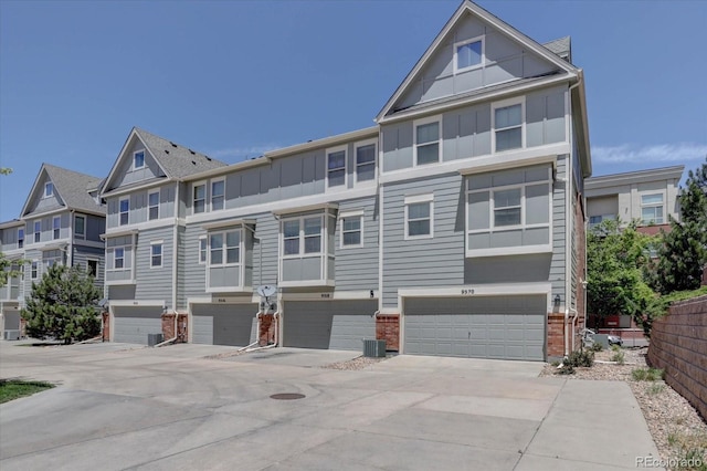 9520 Halstead, Lone Tree, CO 80124 - multi unit property featuring board and batten siding, a garage, and brick siding