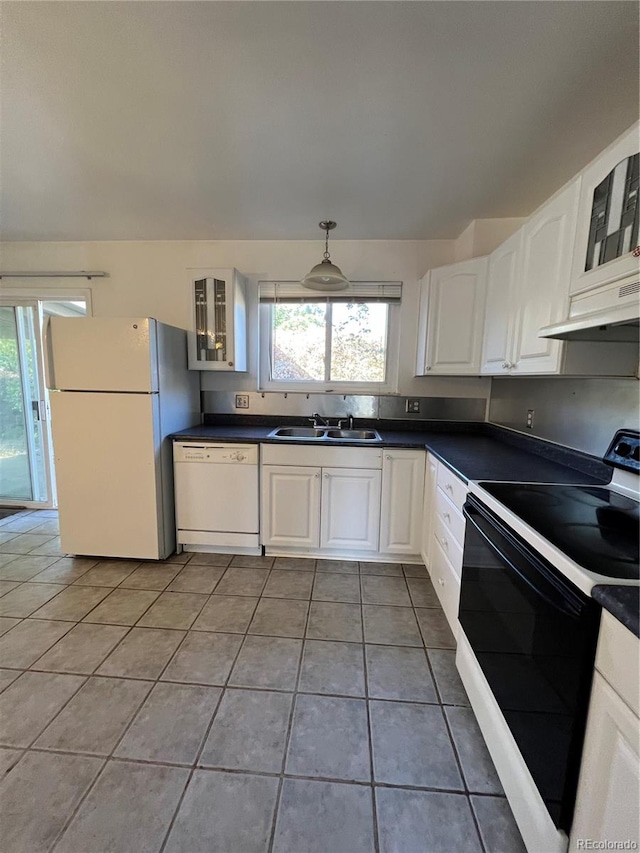 kitchen featuring exhaust hood, sink, light tile patterned floors, white cabinets, and white appliances