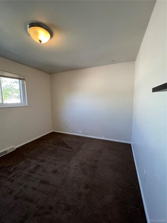 view of carpeted spare room