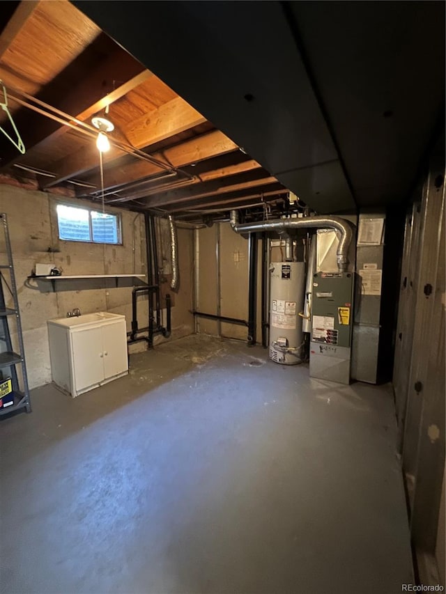 basement with water heater and heating unit