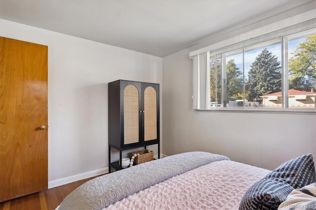 bedroom featuring dark hardwood / wood-style flooring