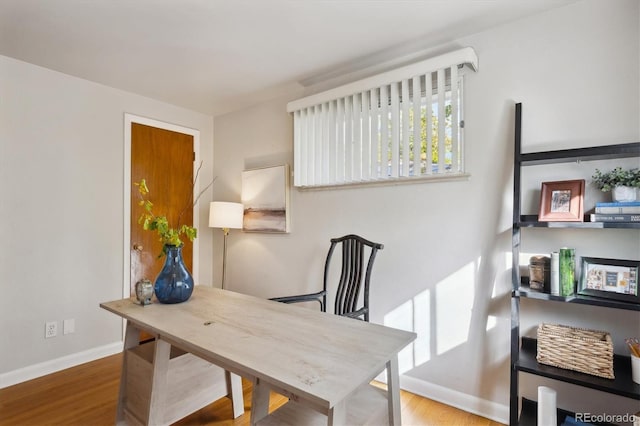 home office with hardwood / wood-style flooring