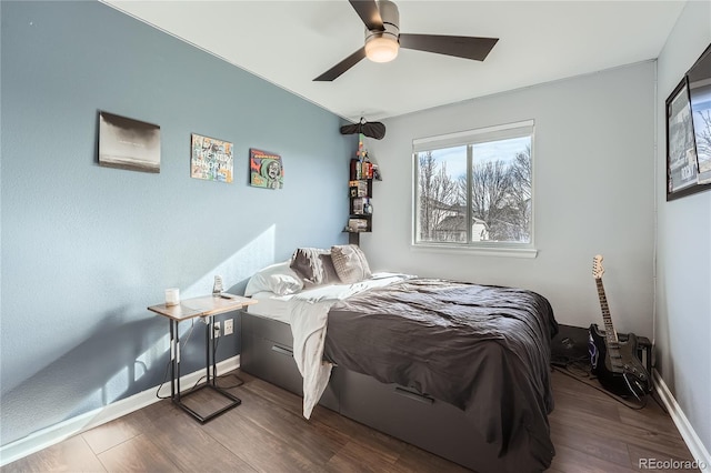 bedroom featuring dark hardwood / wood-style floors and ceiling fan