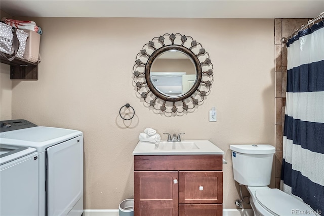 clothes washing area with independent washer and dryer and sink