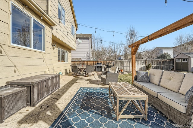 view of patio / terrace with an outdoor living space and a grill