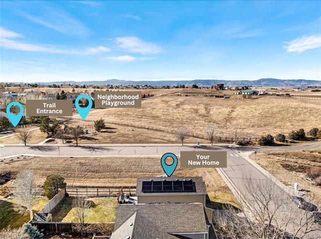 drone / aerial view with a mountain view and a rural view