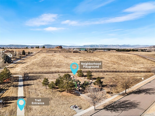 birds eye view of property featuring a mountain view and a rural view