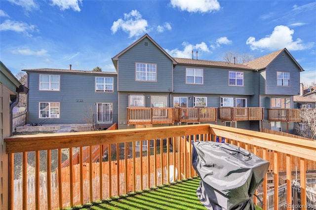 wooden deck featuring fence and grilling area