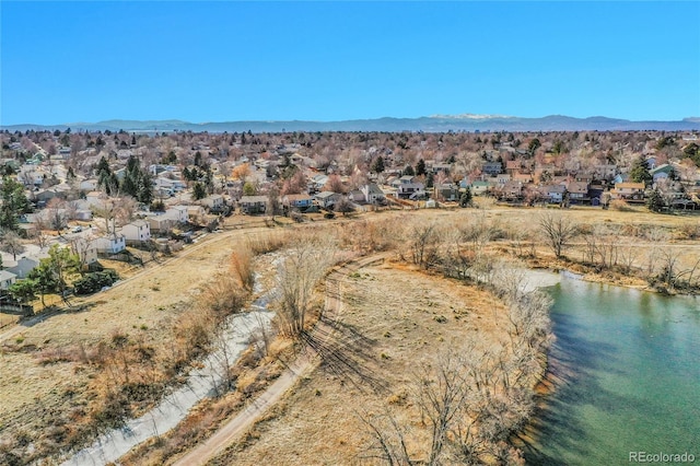 aerial view featuring a residential view and a water and mountain view