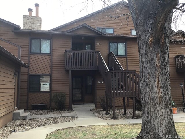 view of front of home with a chimney