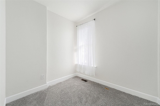 carpeted empty room with plenty of natural light