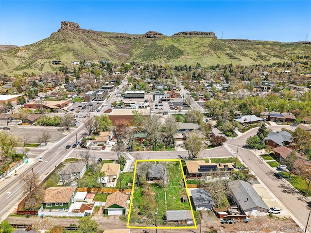 1914 Washington Ave, Golden, CO 80401 - aerial perspective of suburban area featuring property parcel outlined and a mountainous background