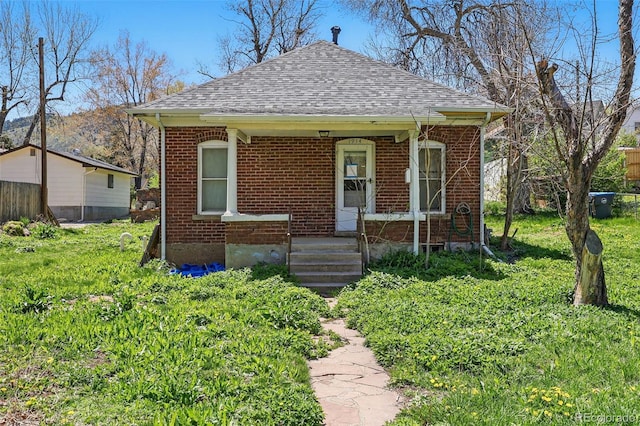 1914 Washington Ave, Golden, CO 80401 - bungalow-style home with roof with shingles and brick siding