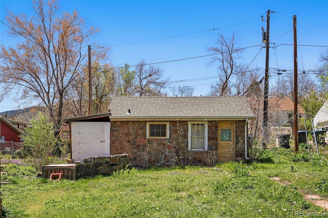 1914 Washington Ave, Golden, CO 80401 - view of front facade featuring stone siding and roof with shingles