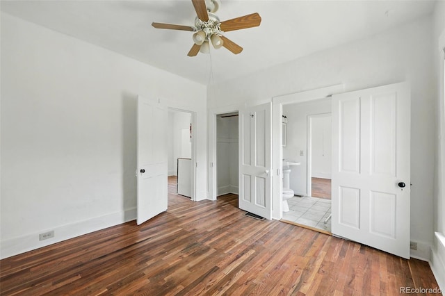 1914 Washington Ave, Golden, CO 80401 - unfurnished bedroom with wood finished floors, a closet, connected bathroom, and ceiling fan