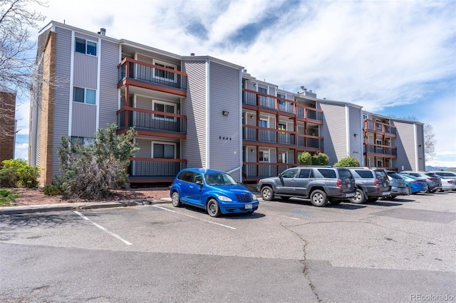 view of property with uncovered parking