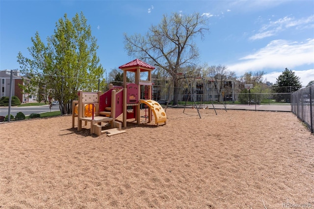 communal playground featuring fence