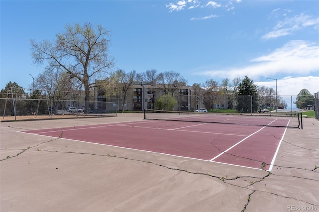 view of sport court with fence