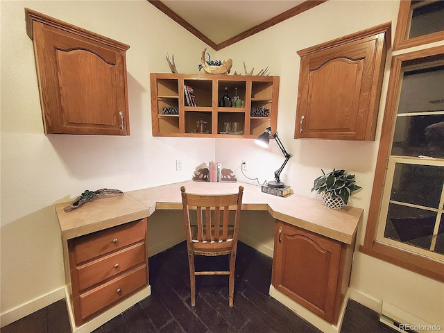 home office featuring built in desk and ornamental molding