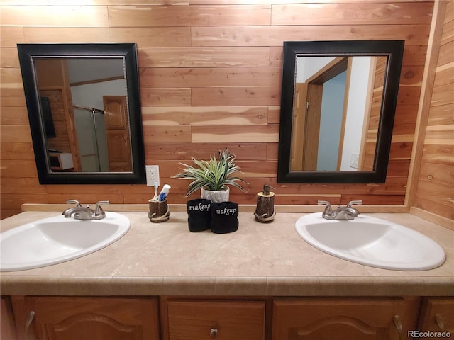 bathroom with vanity and wooden walls