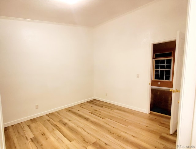 unfurnished room with light hardwood / wood-style floors