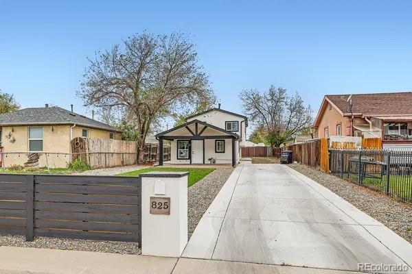 825 S Quitman St, Denver, CO 80219 - bungalow-style house featuring a fenced front yard, a gate, and covered porch