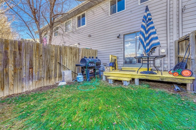 view of yard with a wooden deck