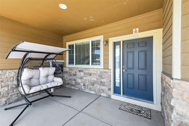 doorway to property featuring covered porch