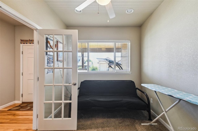 sitting room featuring ceiling fan and wood-type flooring