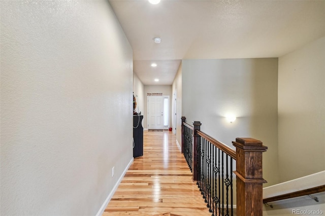 corridor with light wood-type flooring