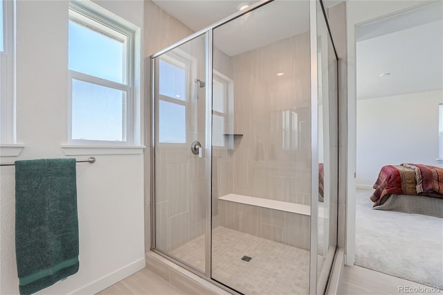 full bath featuring a stall shower and ensuite bathroom