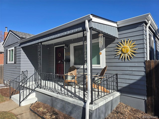 doorway to property with a porch