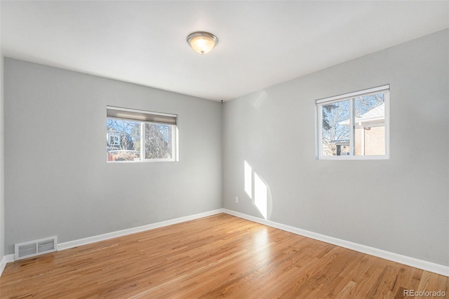 empty room with wood-type flooring