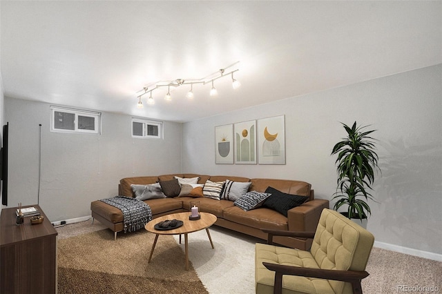 living room featuring track lighting and carpet