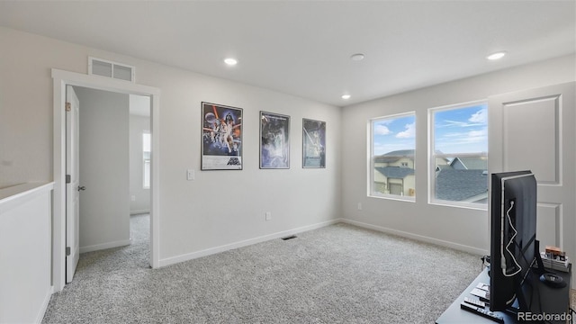unfurnished office featuring baseboards, visible vents, and carpet