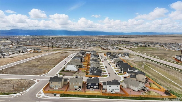birds eye view of property featuring a mountain view and a residential view