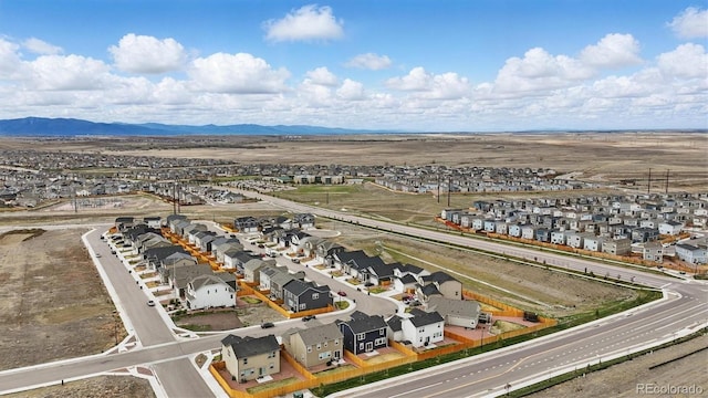 birds eye view of property with a mountain view and a residential view