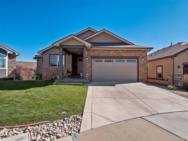 view of front of home featuring a garage and a front lawn