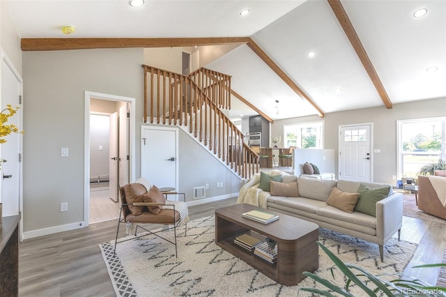 5195 Allison St, Arvada, CO 80002 - living area featuring stairs, wood finished floors, and recessed lighting